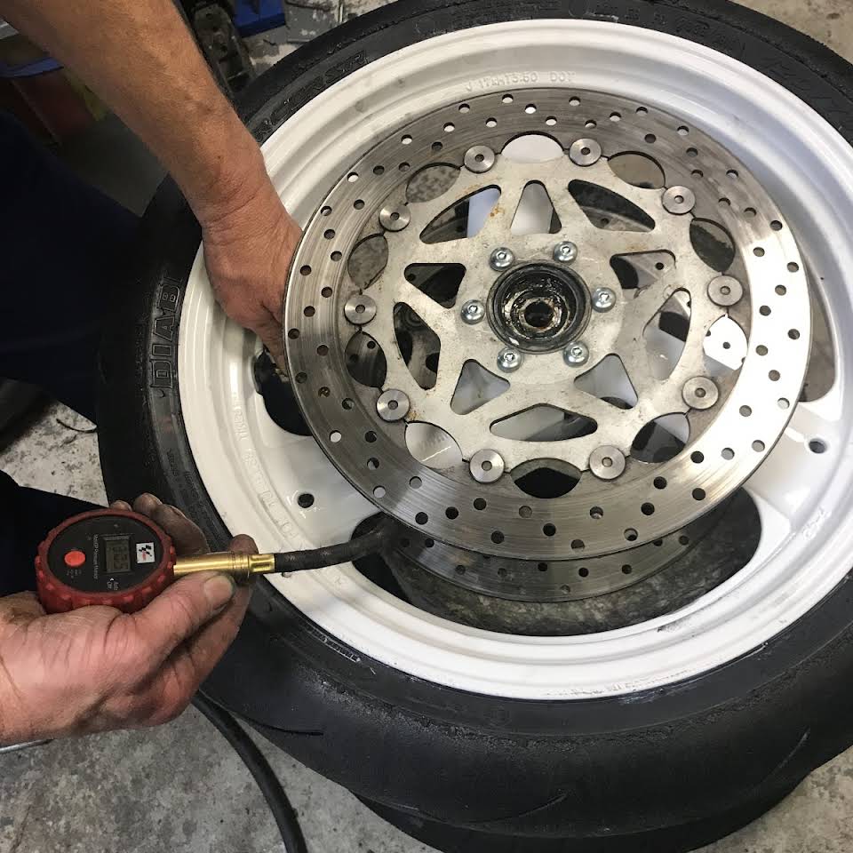 Inflating motorcycle tyres